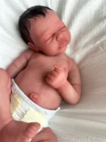 Oliver is poured in platinum grade marshmallow silicone giving his skin a very realistic feel