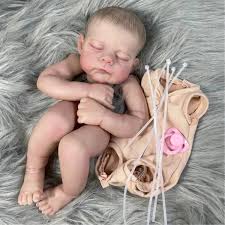 Reborn Doll Making Class Near Me - Hands painting a lifelike reborn doll in a workshop